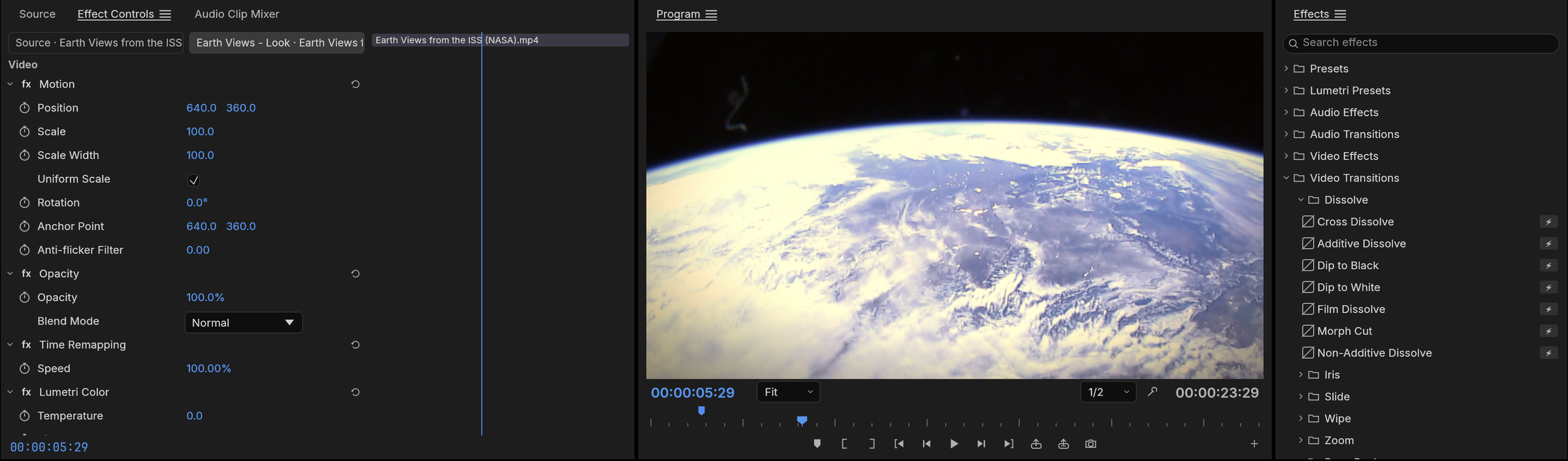 Effects workspace: Effect Controls with Motion, Opacity, Time Remapping and a colour grade, NASA's Earth Views from the ISS in the Program monitor, and the Effects browser open on the Dissolve transitions
